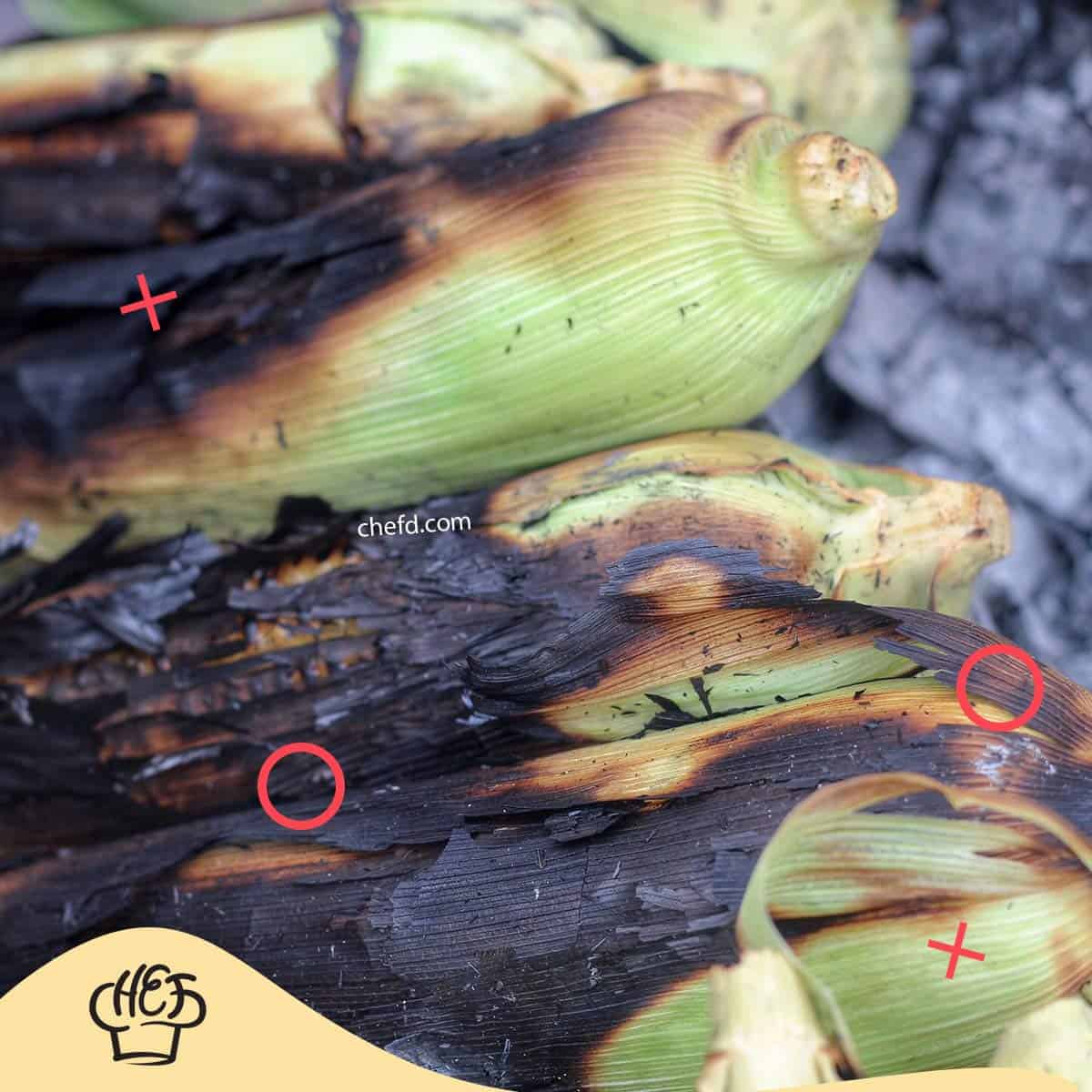 Image of burnt corn husks on the grill.