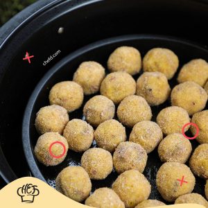 Image of potato balls in air fryer.