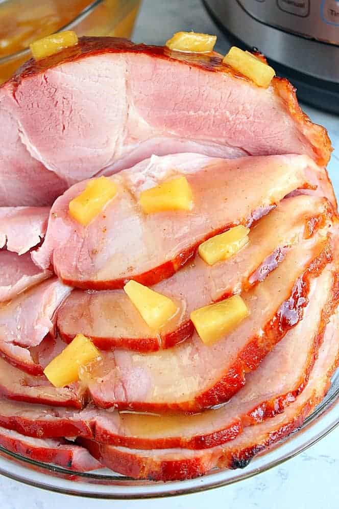 Image with Pineapple Brown Sugar Ham cooked in the Instant Pot under 30 minutes.