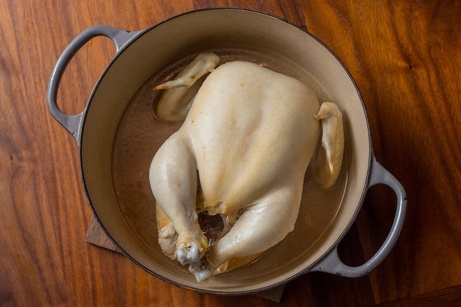 How to boil chicken - whole chicken in a pan of boiling water