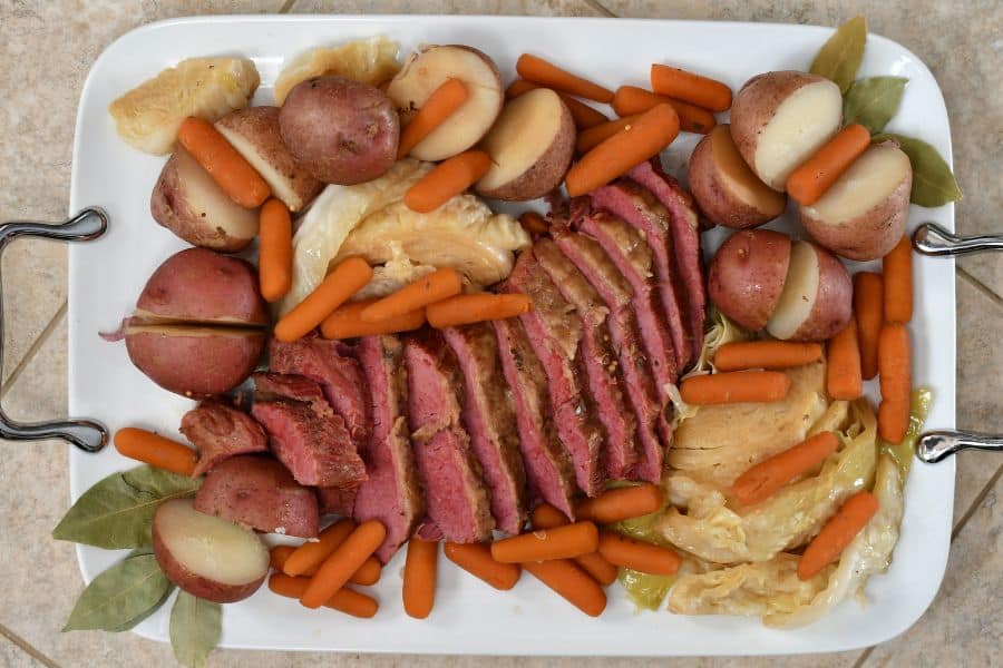 A traditional St. Patrick's Day meal of corned beef and cabbage arranged on a platter