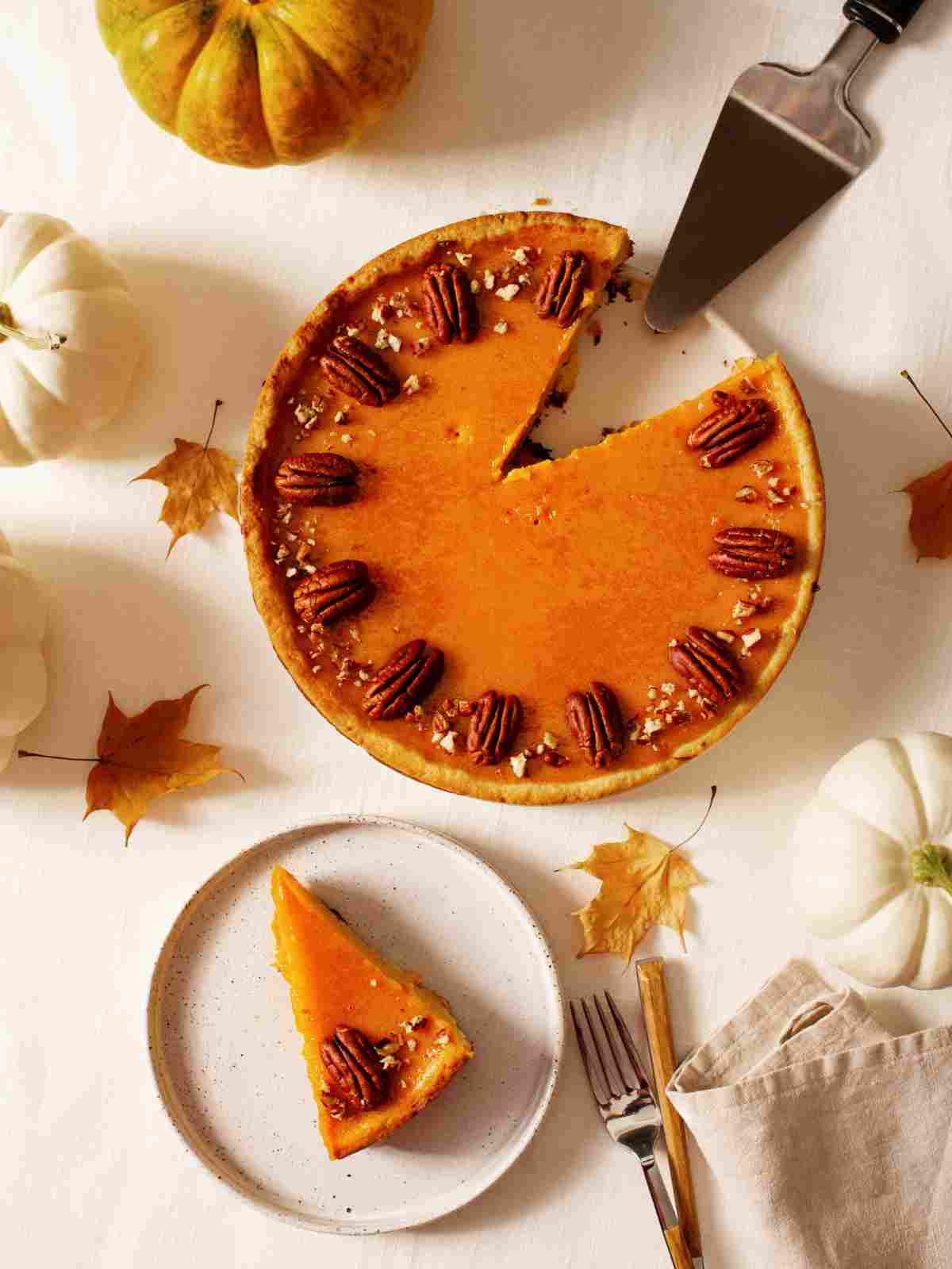 Image with delicious pumpkin pie topped with nuts chefd.com.